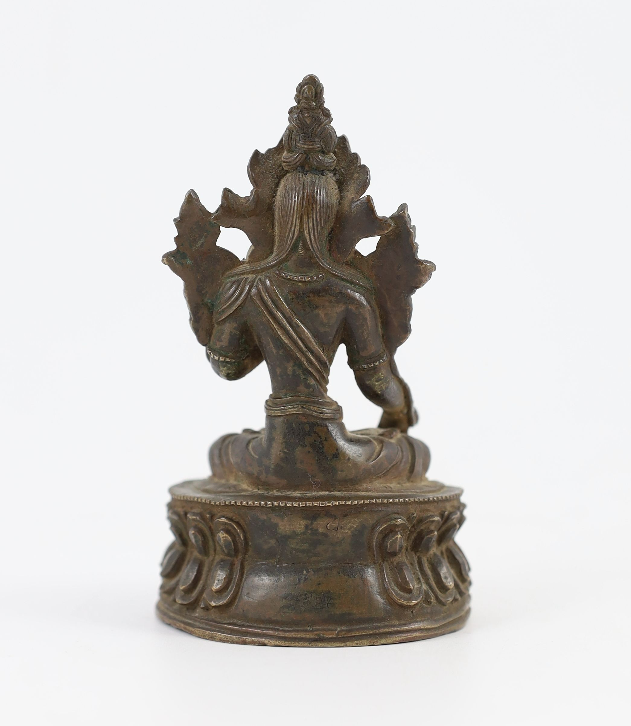 A Tibetan bronze seated figure of White Tara, 17th/18th century, 11 cm high